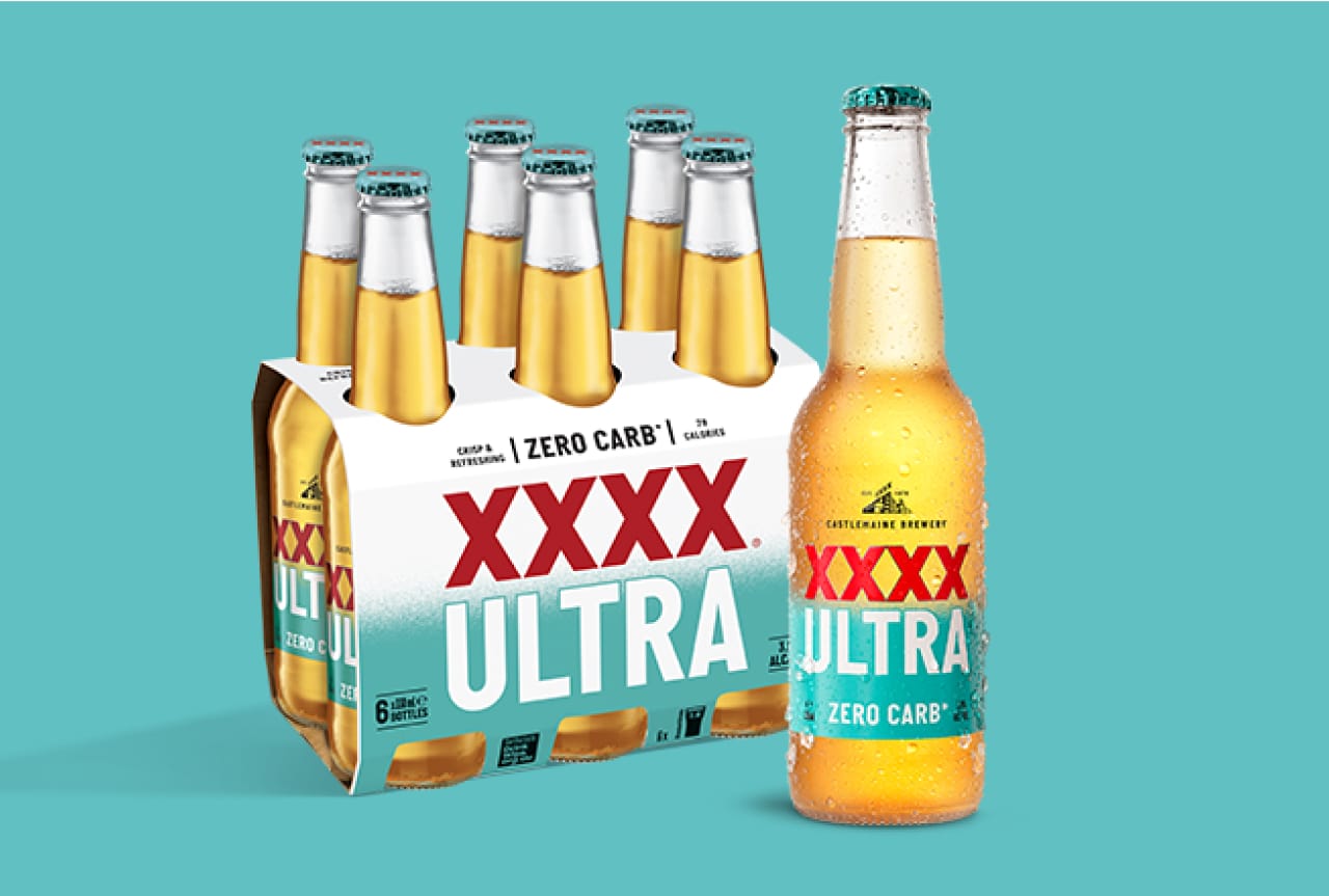 A bottle and 6 pack of XXXX Ultra Zero Carb